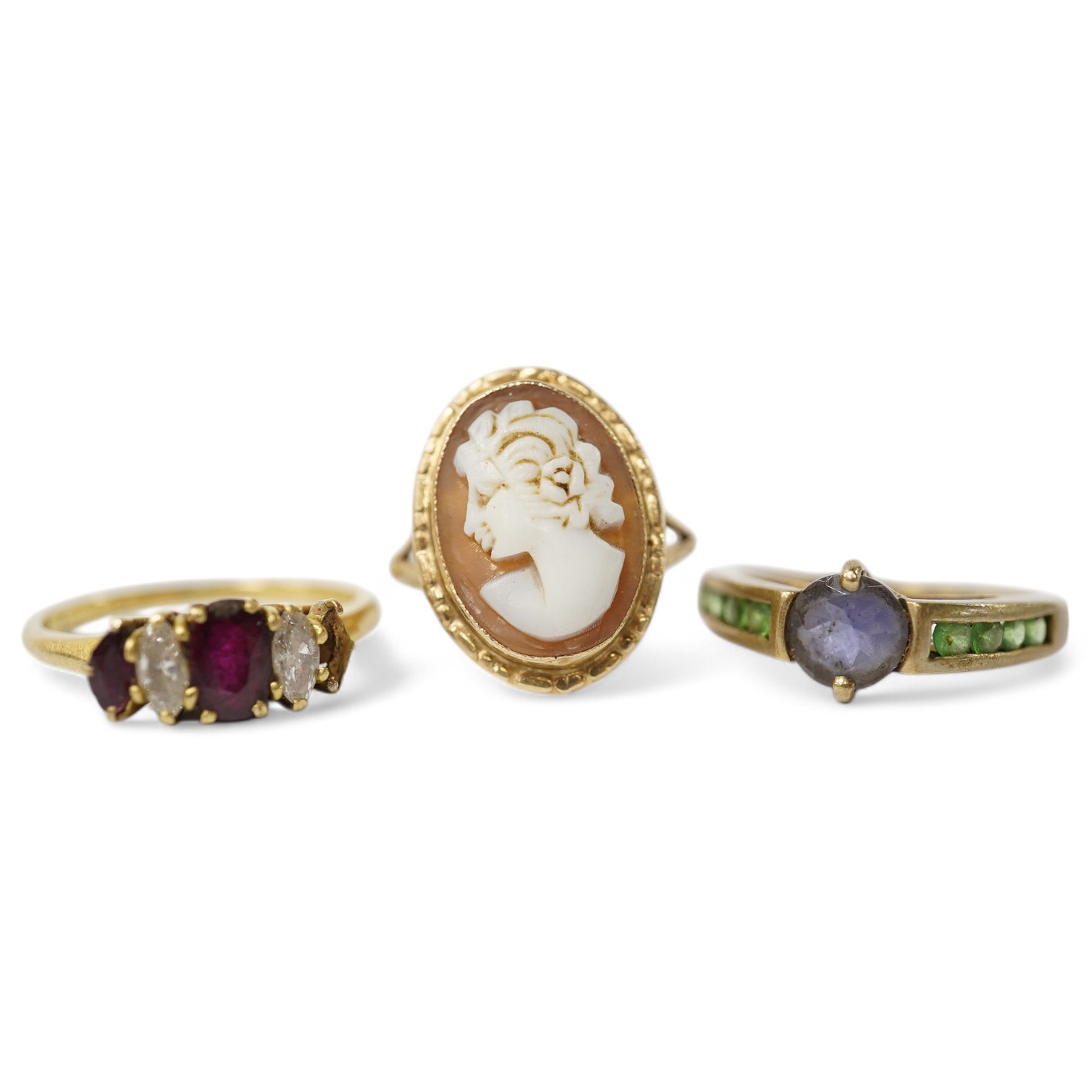 A late 1970's 18ct gold three stone ruby and two stone diamond set ring (one ruby missing), size N/O, gross weight 2.7 grams and two other 9ct gold and gem set rings including cameo shell, gross 5 grams. Condition - poor